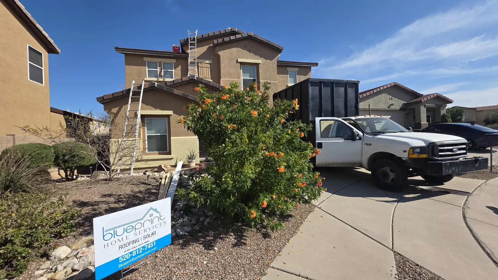 Blueprint Home Services truck and sign at a Tucson job site